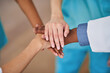 © Meeko Media - Diverse Medical Team Stacking Hands in Unity at Hospital