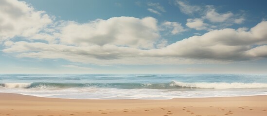 Poster - The stunning clouds form a captivating backdrop against the sandy beach, creating a picturesque scene with ample copy space image.