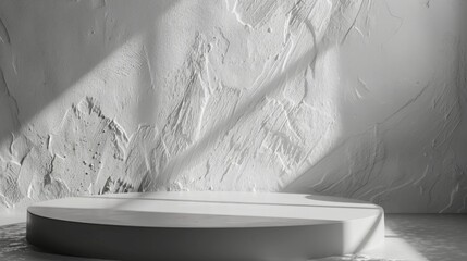 Leinwandbilder - A modern, minimalist white display podium rests against a textured wall with sunlight streaming in, casting shadows.