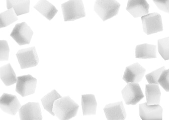 Wall Mural - Refined sugar cubes in air on white background