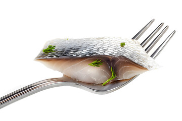 Wall Mural - Pieces of salted herring on fork isolated on white background