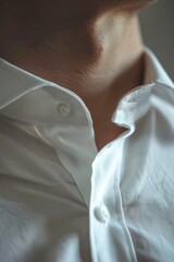 Poster - Close-up shot of a person wearing a white shirt, ideal for use in editorial or commercial contexts