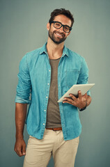 Poster - Man, portrait and tablet by gray background with smile for social media, internet or website search. Fashion designer, happy and technology for b2b ecommerce, startup and online or digital catalog