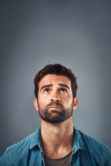 Aufkleber - Ideas, thinking and man with decision, confused and problem solving on grey studio background. Frustrated, person and model with questions, mockup space and solution with doubt, choice and remember