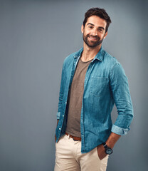 Poster - Mockup, fashion and smile with portrait of man in studio on gray background for relaxed clothing style. Casual, happy and space with handsome person in clothes outfit to model jacket or wardrobe