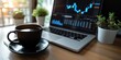 © Wendy2001 - Cup of coffee on digital stock market graph background