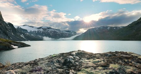 Wall Mural - Sunset against the backdrop of the Norwegian mountains. Beautiful Nature Norway natural landscape.