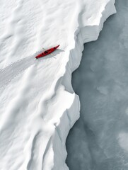 Wall Mural - a kayaker on the edge of a large iceberg