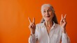 © Studio Nova - Elderly woman showing peace signs