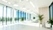 © Rocher Creative - Beautiful blurred background of a modern office interior with panoramic windows, plants and beautiful lighting.