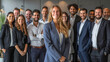 © Michael - Happy female leader with diverse colleagues in the background