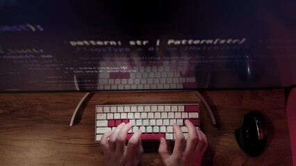 Hands of Professional Programmer is typing code. Top down shot. Move camera