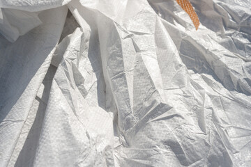 Wall Mural - white synthetic material sacks close-up