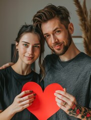 Poster - Couple Holding Red Paper Heart