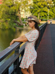 girl in a straw hat on the river bank, summer, summer vacation, travel, portrait, natural face, no plastic surgery