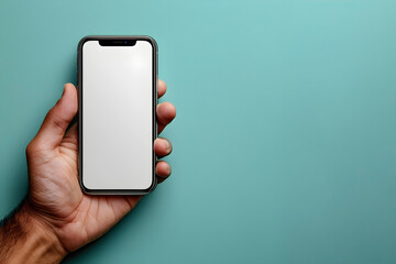 Mockup of a man's hand holding an iPhone on the side of the frame isolated with a blue color background.