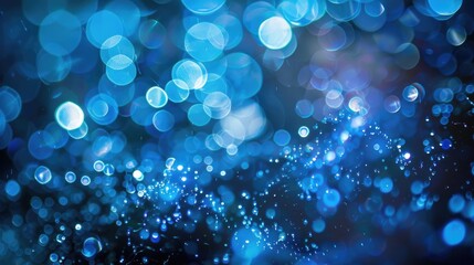 Wall Mural - Abstract background featuring blue winter bokeh lights