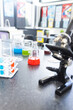 © Wavebreak Media - In school, colorful liquids in beakers and test tubes are sitting on lab bench