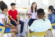 © Wavebreak Media - Diverse teenagers gather in a bright high school setting