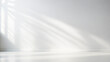 © eugenepartyzan - Minimalistic light background with blurred foliage shadow on white wall