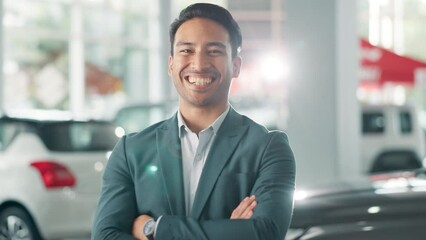 Canvas Print - Arms crossed, car dealership and smile with face of salesman on showroom floor for bargain or deal. Finance, portrait and retail with happy vehicle trader in suit for consulting, service or transport