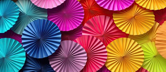 Poster - colorful origami papers forming circular shapes or fans to decorate a wall with copy space image.