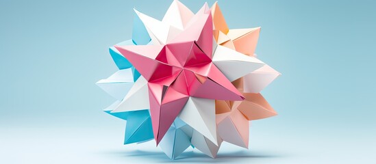 Wall Mural - A multicolored handmade origami Kusudama ball displayed on a pink background with a top view, close-up shot, and selective focus, emphasizing the artwork and providing space for additional imagery.