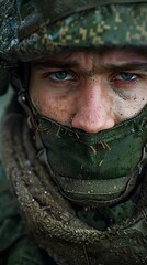 Canvas Print - Portrait of a soldier wearing a green uniform and a mask