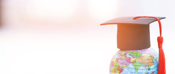 Wall Mural - Graduation cap with Earth globe ideas for studying abroad