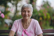 © Ula - October Breast Cancer Awareness month, elderly Woman in pink T- shirt with Pink Ribbon for supporting people living and illness. International Women, Mother and World cancer day concept
