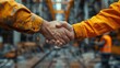 © Wiseman - successful deal male architect shaking hands with client in construction site after confirm blueprint for renovate building .stock photo