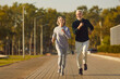 © Studio Romantic - Active senior pair running, sporty physically energetic older man and woman outdoor jogging. Elderly people on street physical exercise, enjoying open air activity to boost mood, energy levels, memory