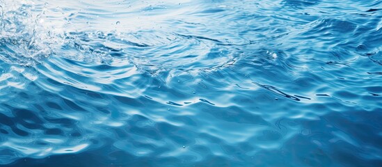 Poster - Closeup blur abstract of surface blue water Abstract of surface blue water reflected with sunlight for background Top view of blue water Water splashed use for background. Creative banner