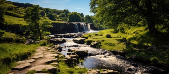 Poster - Ingleton Waterfalls Trail is a local circular trail beginning and ending in the village of Ingleton. Creative banner. Copyspace image