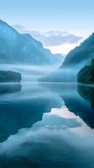 Poster - Majestic Mountain Lake Shrouded in Dawn Mist Serene Natural Landscape with Tranquil Waters and Misty Atmosphere