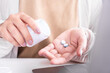 © doucefleur - Close up woman pouring pain killer medicines from bottle, taking pill for treatment , health care and medical concept