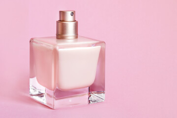 Poster - Perfume on pink background