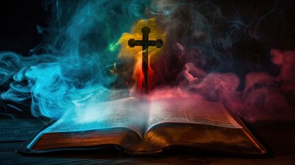 Wall Mural - open Holy Bible with christian cross with colorful smoke cloud, on black wooden background for overlay