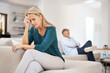 © Jadon Bester/peopleimages.com - Couch, couple and fight in home for annoyed, divorce or married people for argument. Disagreement, sofa and lounge for frustrated woman, affair or emotion in toxic relationship with mature partner