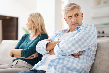 Poster - Mature, man and couple fight in home on sofa, people and domestic issue or ignore for infidelity affair. Crossed arms, frustrated and conflict in living room together, divorce and relationship drama