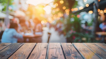 Wall Mural - Empty wooden table with blurred restaurant background. Rustic wooden table with blurred background of people dining at a restaurant, perfect for product placement or design mockup.