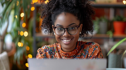 Poster - female entrepreneur extremely happy because she starts making money in her online store . afro woman with laptop 