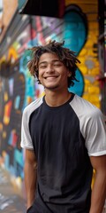 Sticker - cool and smiling teenager in raglan, the main part is black and white. The environment is modern and urban, reflecting a modern lifestyle, with elements such as colorful graffiti in the background.