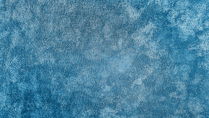 close up view of monochrome blue carpet texture background for interior, indoor decoration. top view of navy fluffy carpet for modern style decoration. terry cloth texture.