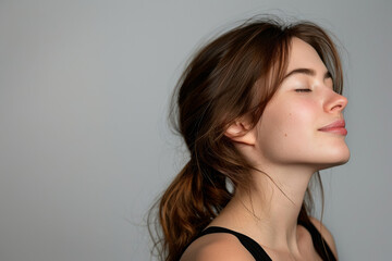 a close up of a woman's face with her eyes closed looking to a side