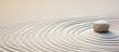 © Ilgun - Zen Japanese garden background with a circular sand pattern for a horizontally oriented banner with copy space image.