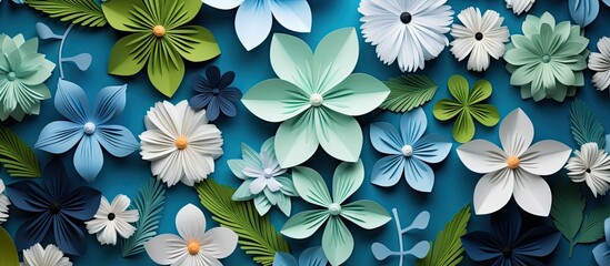 Wall Mural - Handcrafted green leaves on a white origami paper background creating an intricate composition with space for adding images. Copy space image. Place for adding text and design