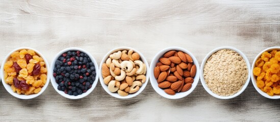 Canvas Print - Create a nutritious breakfast by combining granola with dried fruits and nuts in a bowl, perfect for a healthy dessert. Top view flat lay image with copy space available.