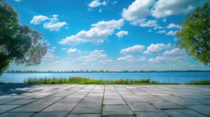Wall Mural - Blue sky and a vacant square ground overlooking a lake in nature