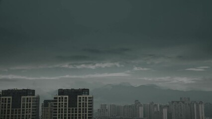 Canvas Print - Time lapse of city buildings on a foggy day